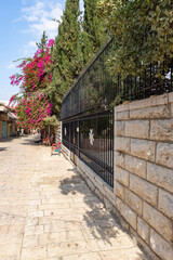 Outer wall with metal gates of the Hospitallers on the Muristan Street in the Christian part of the old city of Jerusalem in Israel