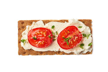 Crispbread with cream cheese and tomato slices on white