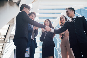 Businessman shaking hands together. Team success concept.