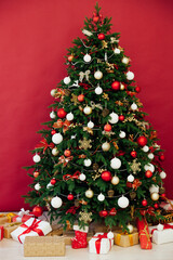 Christmas tree with gifts in the interer lights garland decor new year