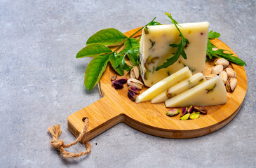 Cheese collection, fresh Italian pecorino cheese made from sheep milk filled with pistachio nuts...