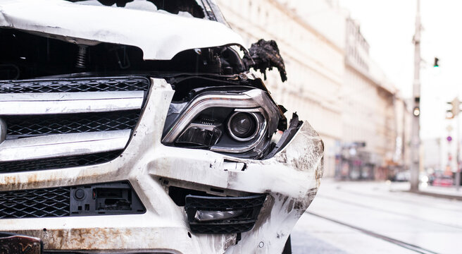 Vehicle with massive damage from traffic accident. Fahrzeug mit massivem Schaden von Verkehrsunfall. Detail
