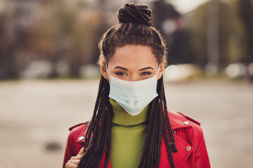 Photo of young attractive african girl wear medical mask quarantine protection prevention corona virus city center