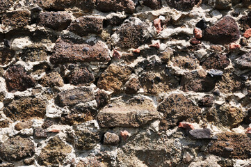 Fototapeta premium Background, texture, porous stone masonry, on cement mortar