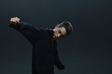 Portrait of a handsome stylish sporty man. Photo for business. Beautiful posing.