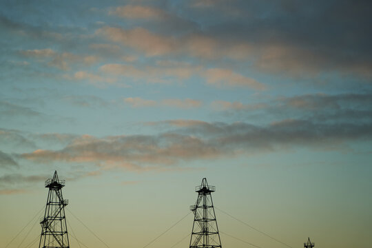 Abandoned Oil Rig With Dramatic Sky Clouds