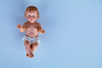 Small statue of Infant Jesus on white background, Christmas concept