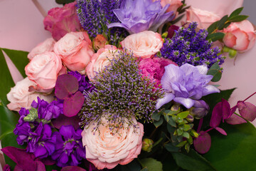 Bouquet of  soft pink flowers in wrapping paper.