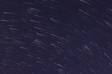 star trail in dark starry night sky