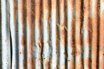 Grunge silver and red rust corrugated iron metal plate textured background