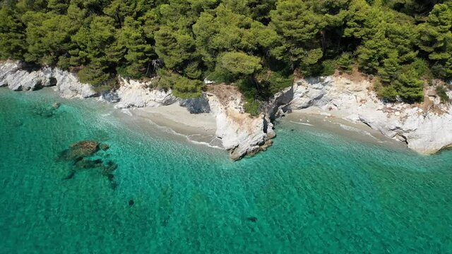 Aerial drone video of breathtaking secluded turquoise beaches of Ftelia and Megalo Pefko in island of Skopelos, Sporades, Greece