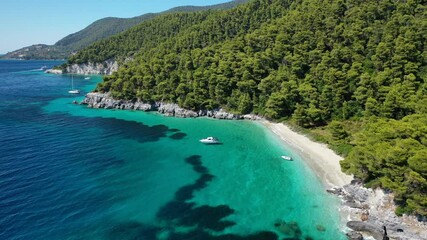 Aerial drone video of breathtaking secluded turquoise beaches of Ftelia and Megalo Pefko in island of Skopelos, Sporades, Greece