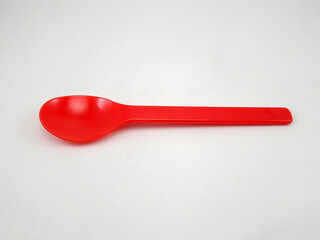 Red plastic disposable spoon for scoop