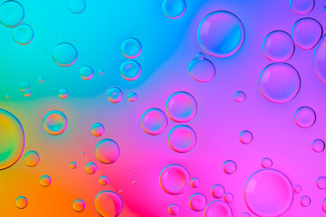 Creative neon background with drops. Glowing abstract backdrop with vibrant gradients on bubbles....