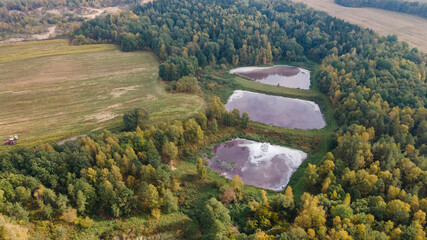 Aerial view of urban sewage filtration ponds system. Sewage farm. Ecology concept.