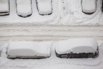 Fototapeta na wymiar winter landscape with snow-covered cars