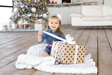 Girl opens Christmas gift