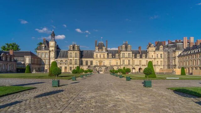 Royal hunting castle Fontainbleau timelapse hyperlapse fromt view with entrance. Palace of Fontainebleau - one of largest royal chateaux in France, UNESCO World Heritage Site.