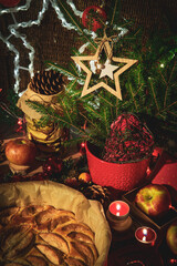 Apple pie on the table decorated in Christmas style