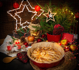 Fototapeta na wymiar Apple pie on the table decorated in Christmas style