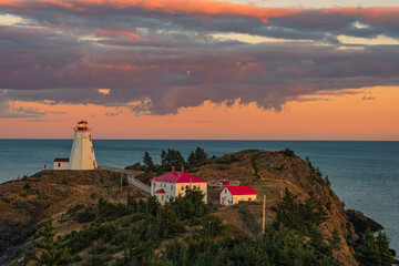 swallowtail Lighthouse at sunset with red clouds