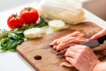 Cooking chicken tenders for a dish at home