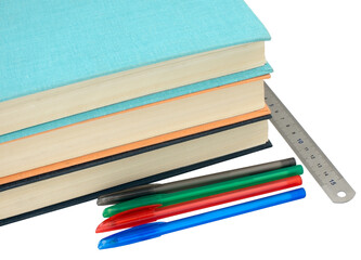 Books, ruler and multi-colored ballpoint pens