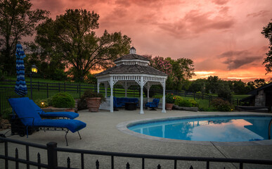 Country living by swimming pool in evening
