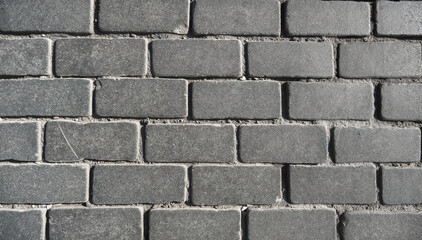 Brick wall made of stone blocks colorless in black and white shot close up