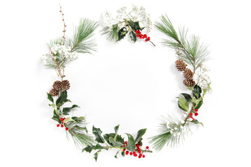 Christmas floral flat lay Frame ilex leaves red berries