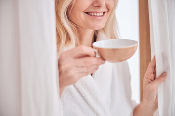 Female client with a herbal drink in the wellness center