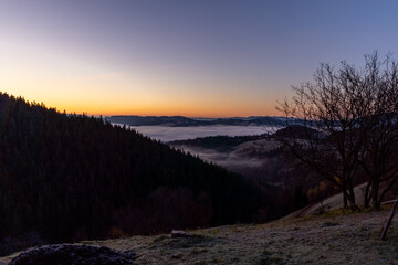 sunrise view from the mountains of Romania autumn with fog