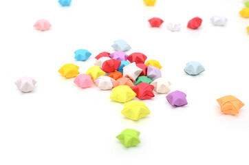Colorful luck stars fall down on white background