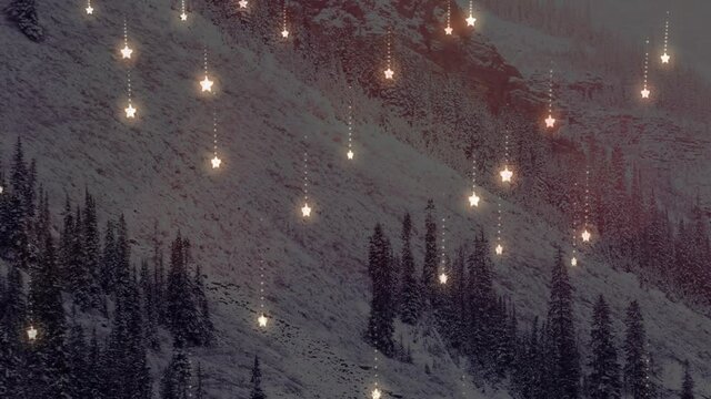 Animation of glowing spots of light over winter scenery with mountains