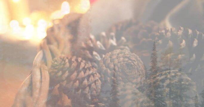 Animation of candles and christmas decoration with pine cones