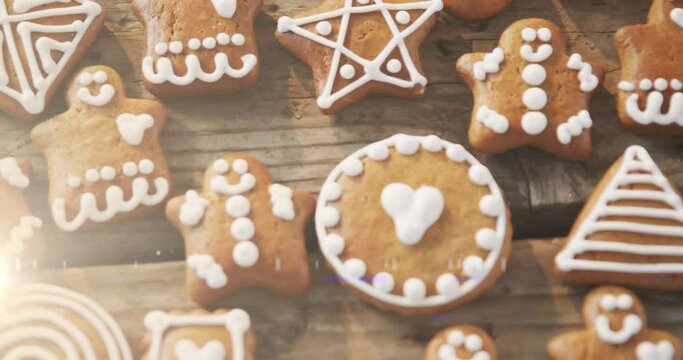 Animation of gingerbread cookies on wooden rustic surface