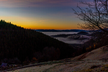 sunrise view from the mountains of Romania autumn with fog