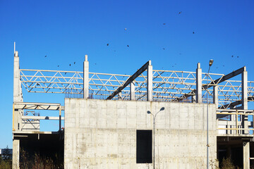 The unfinished building is abandoned for a long time.