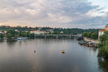 Fototapeta na wymiar Panoramic view of Vltava river in Prague at sunset time.