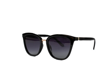 Fototapeta premium Female black sunglasses isolated on white background. Selective focus.