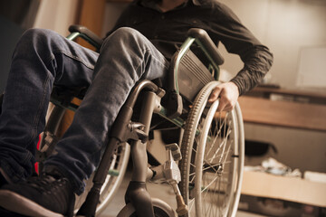man is sitting in a wheelchair