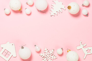 Christmas pink flat lay background with holiday decorations.