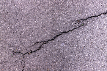 Close-up concrete asphalt exterior cracked seamless patterned texture