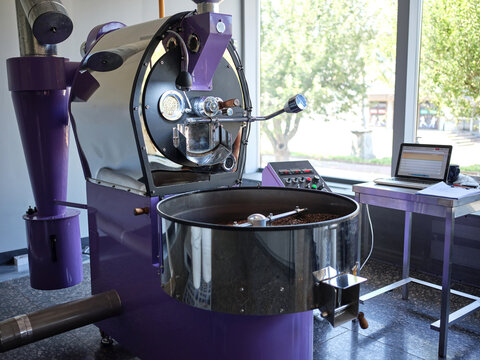 Transforming From Green To Brown. Interior Of Little Coffee Roasting Factory. Process Of Roasting Coffee Beans In A Modern Coffee Roaster Machine