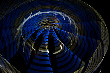 illuminated moving big wheel at night in closed amusement park