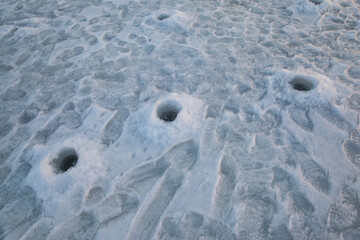 holes in the ice for winter fishing