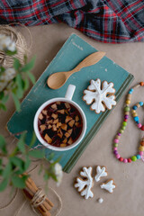 Autumn cozy background with a cup of tea, a warm sweater and old books. Flat lay for bloggers
