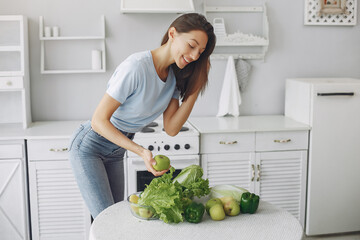 Healthy eating. Dieting and people concept. Brunette with a vegetable.