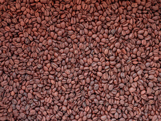Coffee pattern. Top view of brown roasted coffee beans background. Horizontal shot