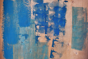 Random paint strokes on plywood as an abstract background.